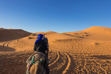 On camel caravan in Sahara desert, Merzouga, Morocco