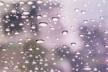 Raindrops on a car windshield after raining