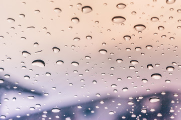 Raindrops on a car windshield after raining
