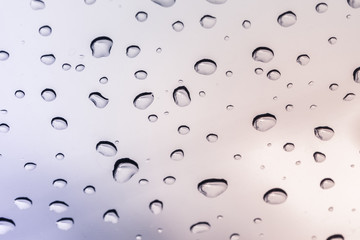 Raindrops on a car windshield after raining