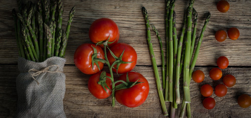 Brunch of Fresh Asparagus on vintage wooden background. place for text