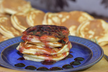 American pancakes with strawberry syrup