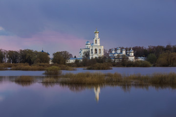 Fototapeta na wymiar Beautiful view at sunset with churches. Monastery in Veliky Novgorod