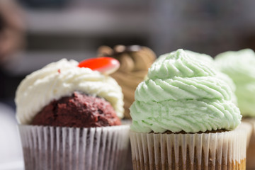 Many sweet handmade muffins close up