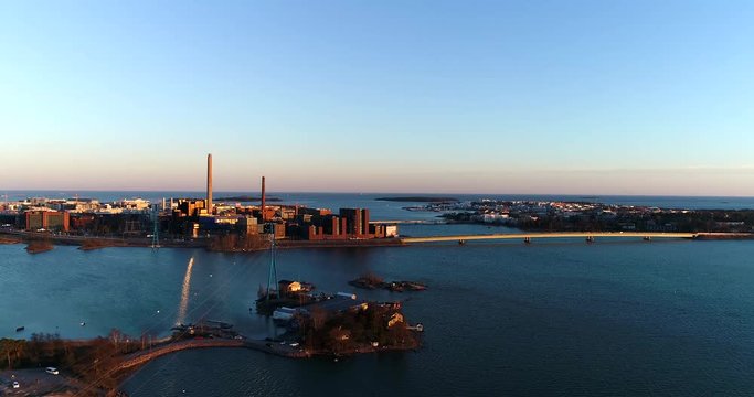 Seurasaarenselk&auml;, Cinema 4k aerial view of a flight towards lapinlahden silta and ruoholahti factories, on a sunny spring evening, in Helsinki, Finland