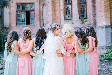 Beautiful bride with her pretty bridesmaids