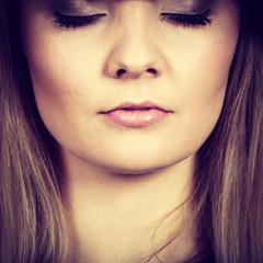 Closeup of woman thinking face expression