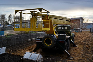 Fototapeta na wymiar crane folded boom on construction site rear view