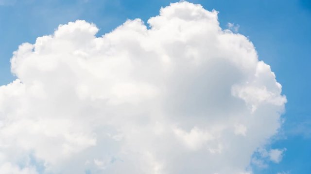 Timelapse of moving clouds and blue sky in summer with sunshine in day time