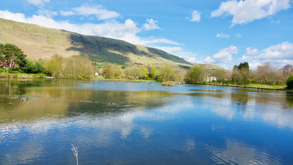 Village Pond with hills and deep blue reflection.jpg