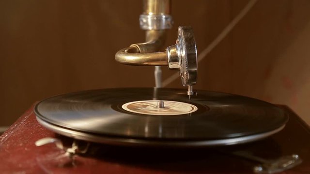 vintage gramophone plays a record