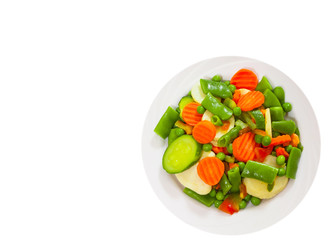 Mixed vegetables on a plate. top view. isolated on white
