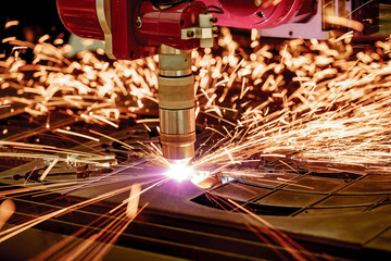CNC Laser plasma cutting of metal, modern industrial technology. .