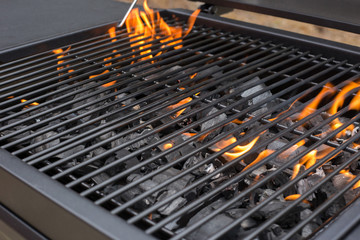 Grill, BBQ, fire, charcoal barbecue, closeup. Roaster grate for cooking