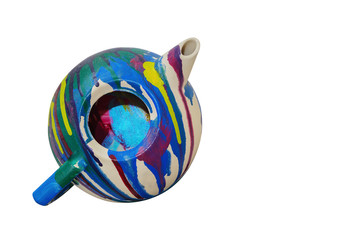 Multicolor painted teapot isolated on the white background with copy space