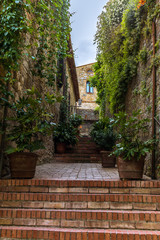 Fototapeta na wymiar Small medieval streets of San Gimignano in Tuscany - 8