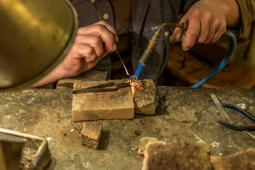 Artisan making a silver ring - 2