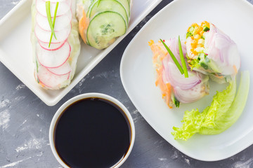 Vegan appetizer - rice paper wraps in a white plate. 