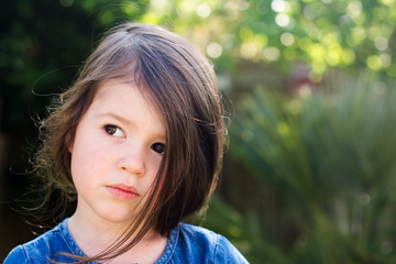 Little girl playing in the garden