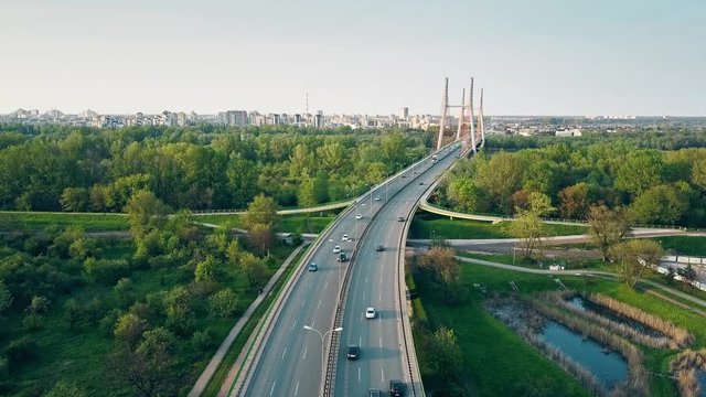 Aerial shot of highway and guyed car bridge in Warsaw. 4K clip