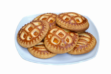 Cookies with dried apricots on a plate. Isolated on white background.