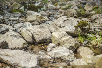 Fototapeta na wymiar A riverbed with big rocks