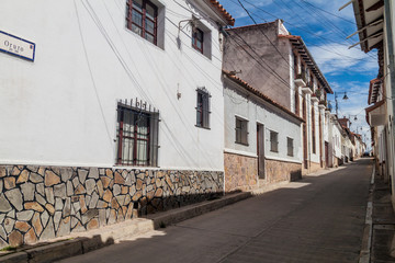 Street with white houses in Sucre, capital of Bolivia.
