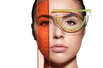 Close-up of a woman's face measure rulers before a plastic surgery to change the proportions....