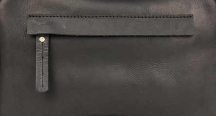 hidden zippered pocket on natural black leather