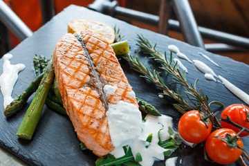 Delicious salmon steak with tomates