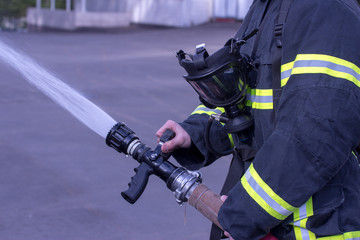 Fototapeta premium Water extingisher in hands