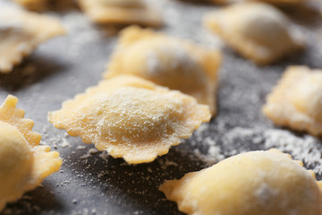 Uncooked ravioli on table, closeup