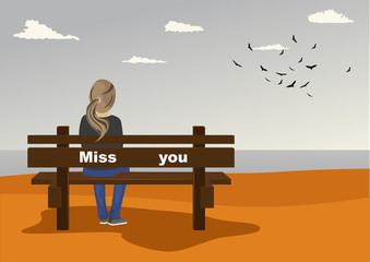 Rear view of young woman sitting on bench on seashore with miss you text on it in autumn
