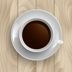 Cup of coffee on  a wooden background. Top view.