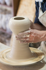Potter makes pottery handmade in the workshop 