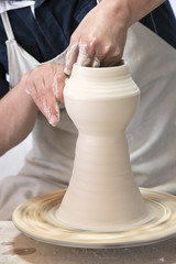 Fototapeta na wymiar Potter makes pottery handmade in the workshop 