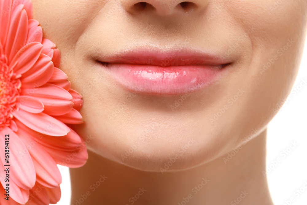 Wall mural face of beautiful young woman and flower, closeup