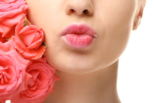 Face Of Beautiful Young Woman And Roses On White Background, Closeup