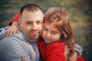 happy father and daughter in summer