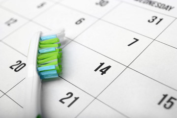 Tooth brush on calendar background