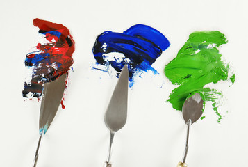 Palette knives with paint on paper