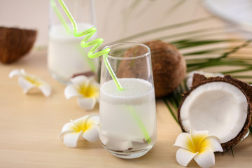 Beautiful composition with coconut water on table