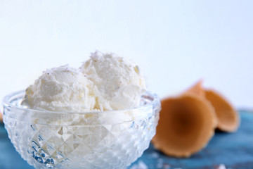 Vintage bowl with fresh coconut ice cream, closeup