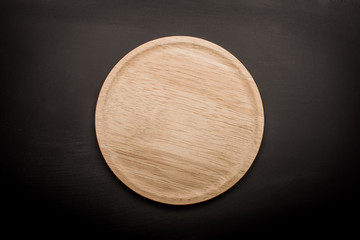 empty wooden plate  wood texture background can use to pizza on plate and copy space etc.;