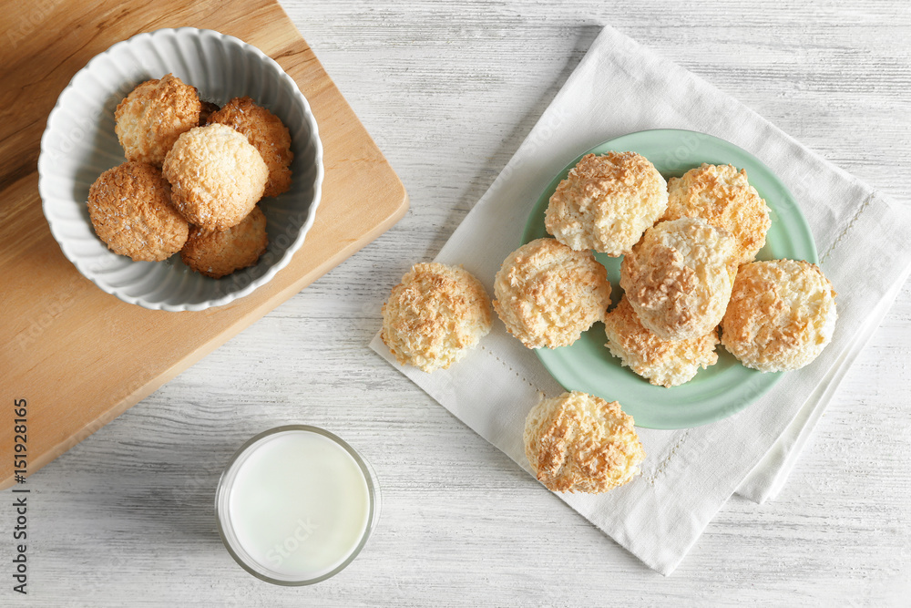 Sticker plate with delicious coconut macaroons on table