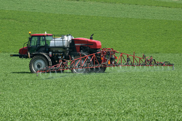 Tractor with agricultural sprayer machine for pesticide spraying