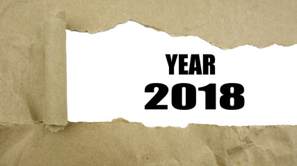 Torn brown paper on white surface with 