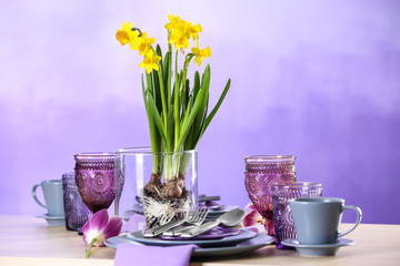 Beautiful table setting on color background
