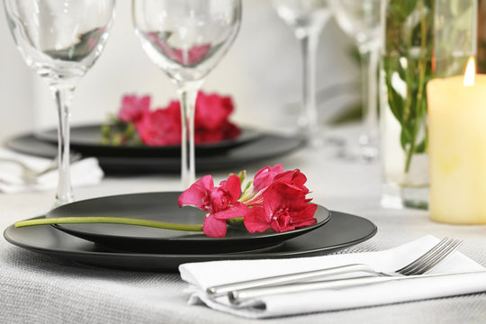 Beautiful festive table setting and flower decor, closeup