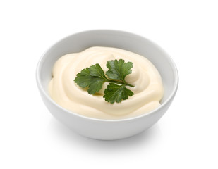 Delicious mayonnaise with parsley in bowl isolated on white